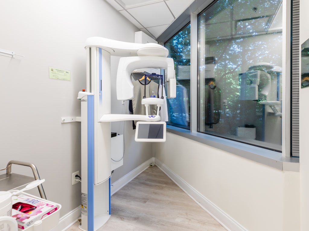 a bathroom with a sink and a mirror  at dental services Reston in Reston, VA