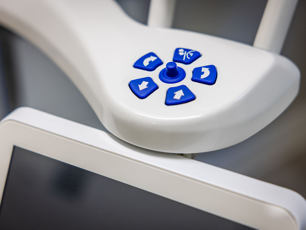 a remote control is shown on a table  at family dentistry in Reston, VA