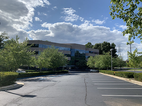 a large building with trees and a street  at CEREC crowns in Reston, VA