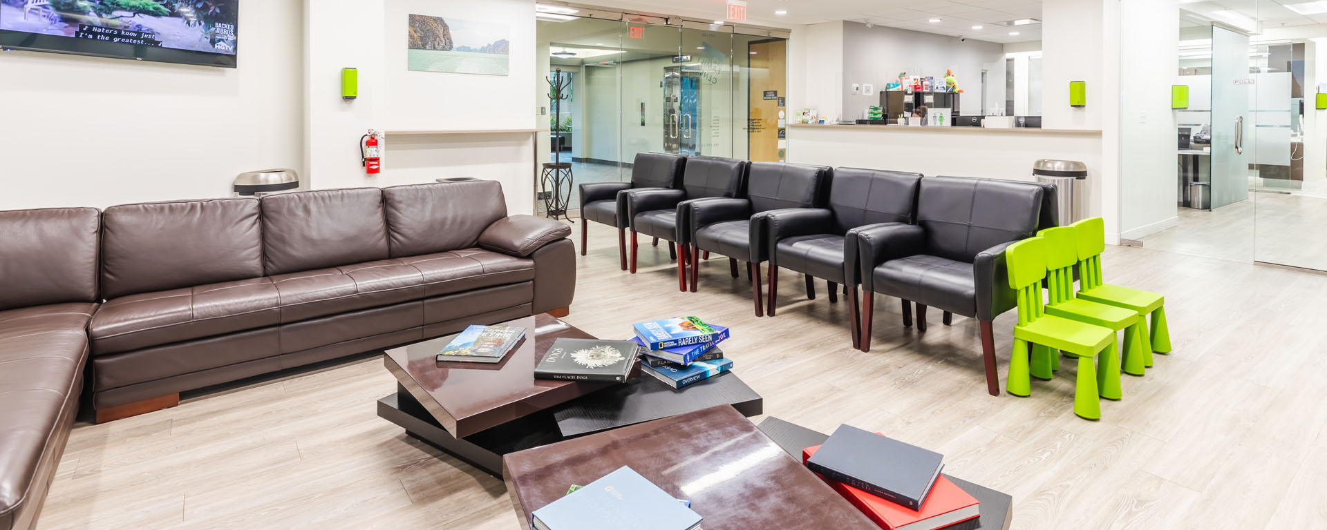 a living room filled with furniture and a large window  at dental implants in Reston, VA