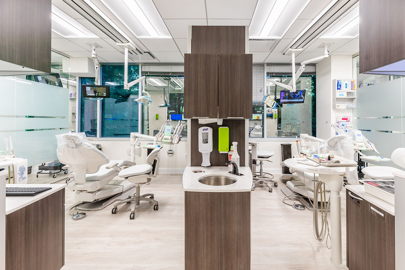 a kitchen with a sink, a refrigerator, and a window  at Invisalign in Reston, VA