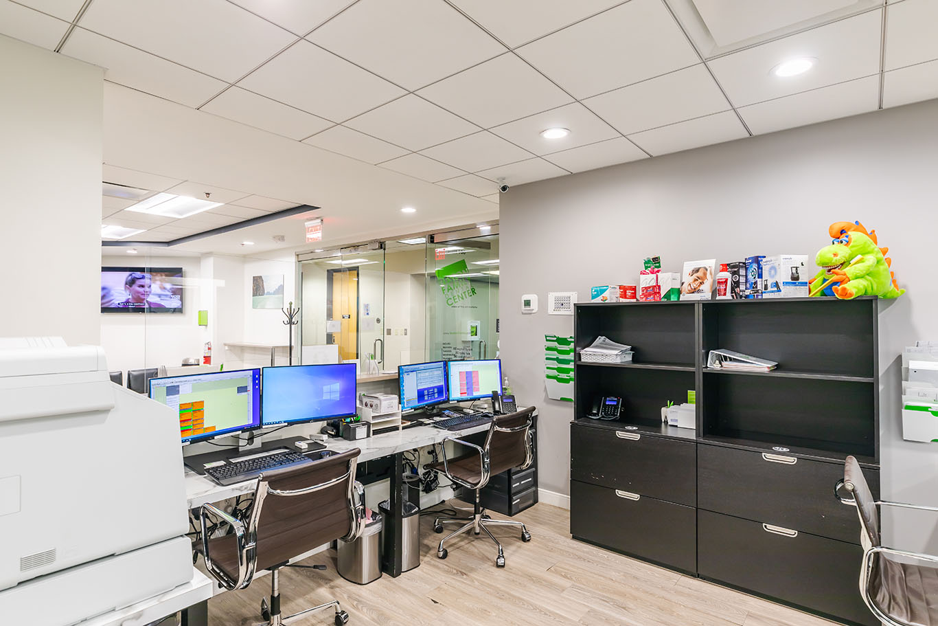 a desk with a computer and a laptop  at cosmetic dentistry in Reston, VA