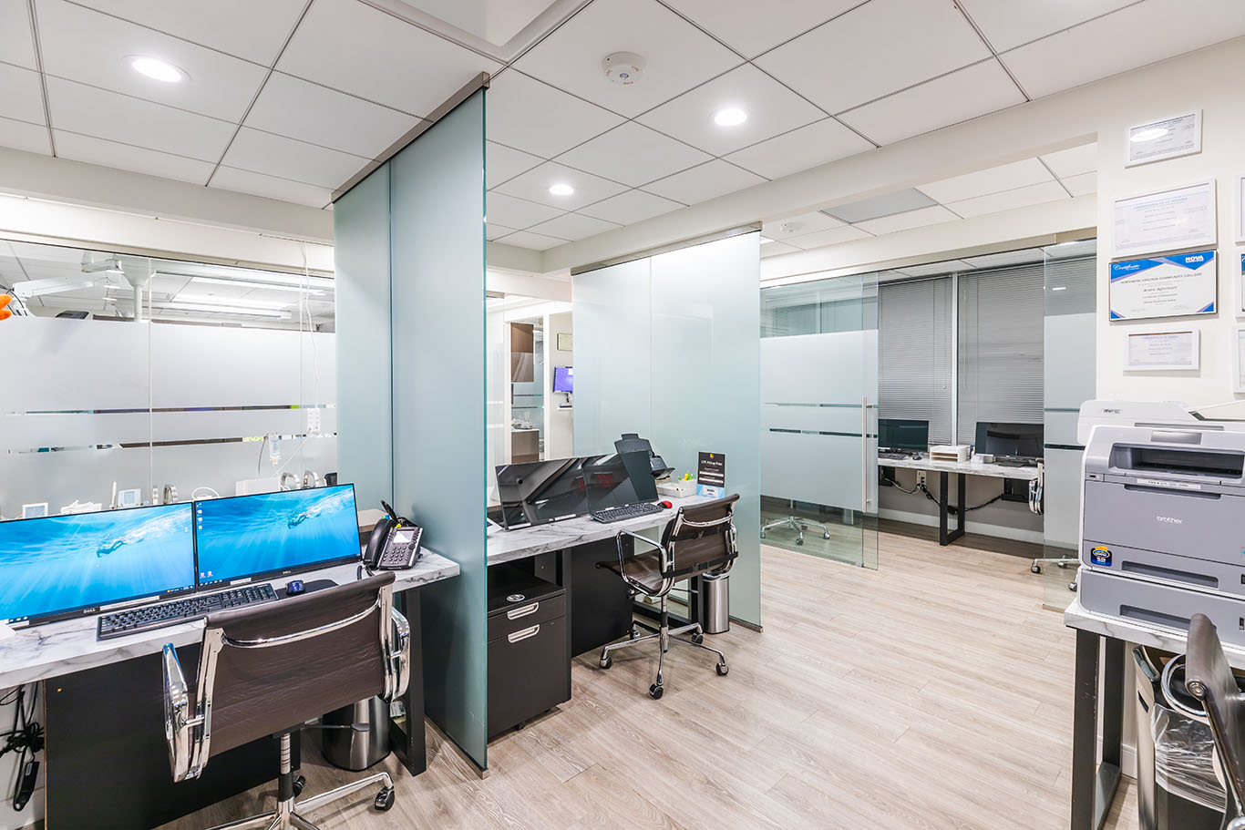 a large room with a desk and a laptop  at CEREC crowns in Reston, VA