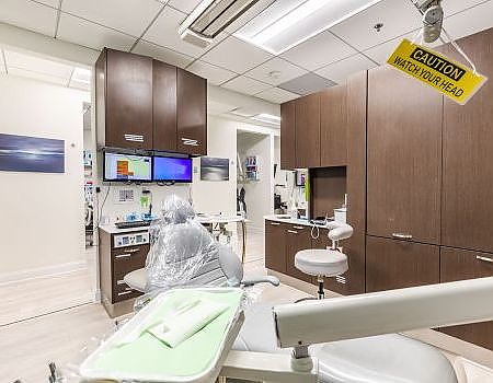 a kitchen with a sink, a refrigerator, and a microwave  at preventive dental care in Reston, VA