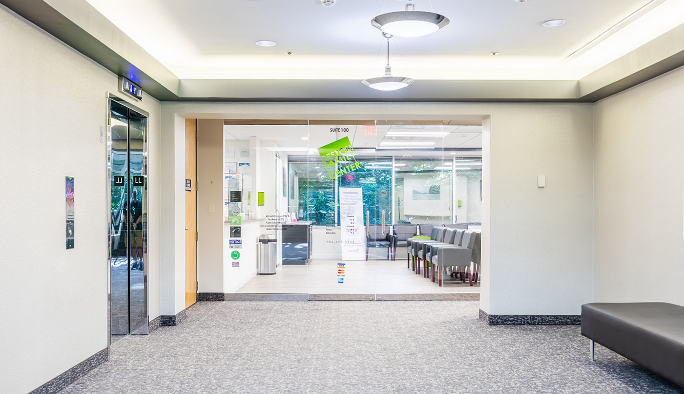 a room with a table and chairs and a door  at pediatric dentistry Reston in Reston, VA