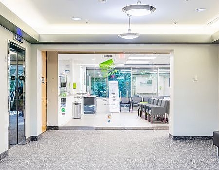 a room with a table and chairs and a door  at pediatric dentistry Reston in Reston, VA