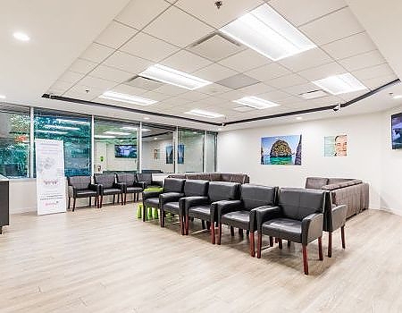 a room with a lot of chairs and a table  at preventive dental care in Reston, VA