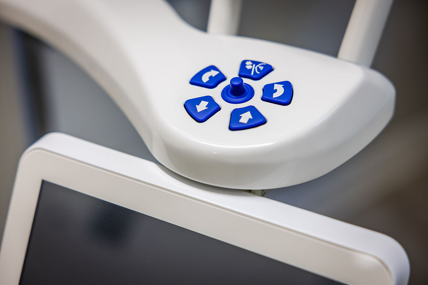 a remote control is attached to a white board  at dental implants in Reston, VA