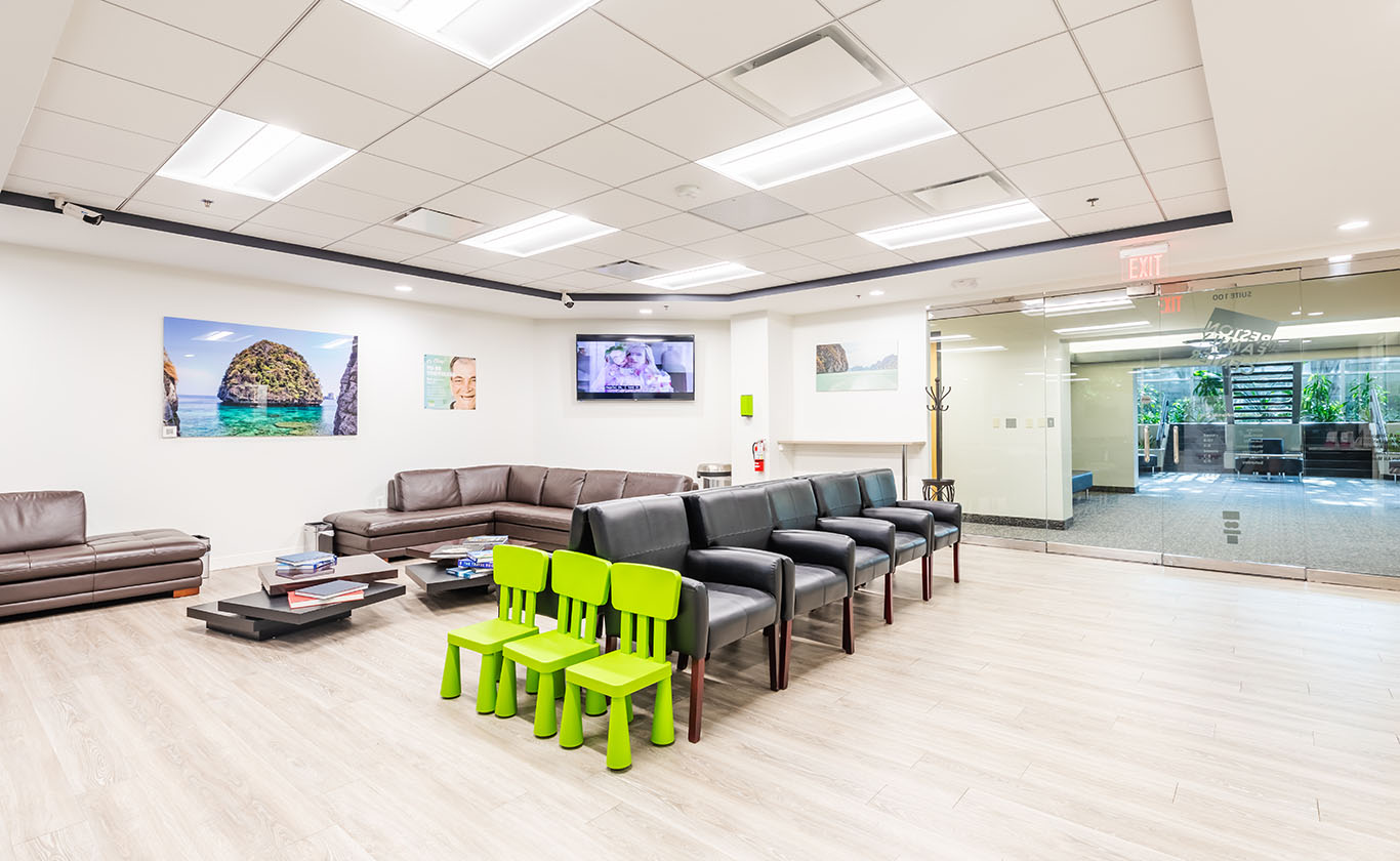 a room with a lot of chairs and a lot of tables  at Reston Family Dental in Reston, VA