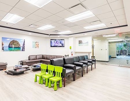 a room with a lot of chairs and a lot of tables  at Reston Family Dental in Reston, VA