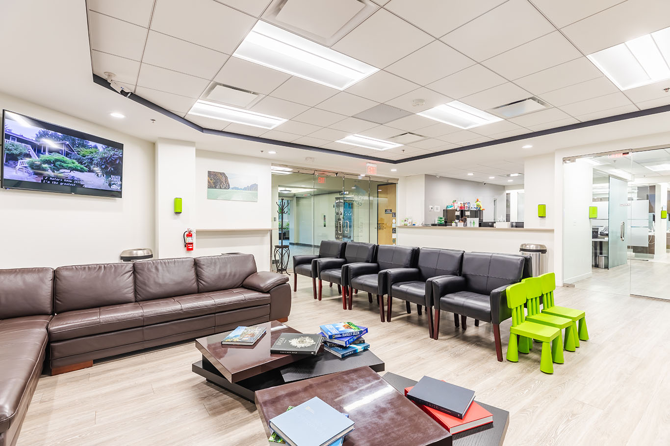 a living room filled with furniture and a large window  at dental services Reston in Reston, VA