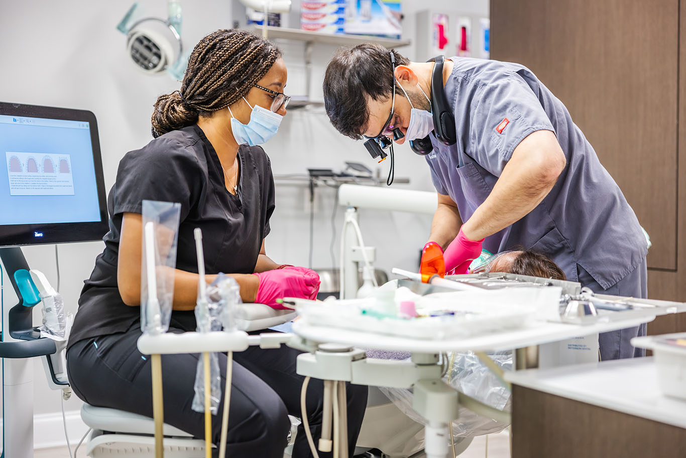 a man and woman are working on a project  at Invisalign in Reston, VA