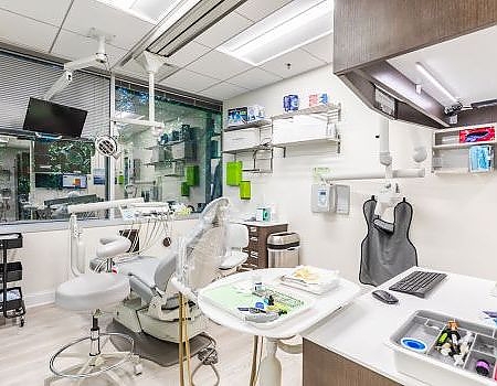 a kitchen with a sink, a toilet and a counter top  at cosmetic dentistry in Reston, VA