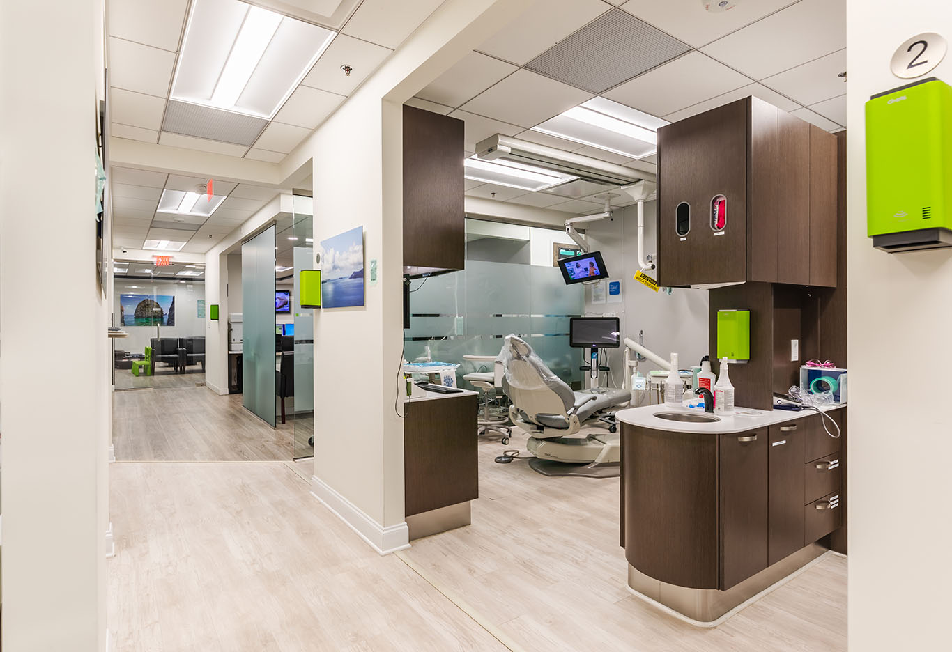 a kitchen with a refrigerator, sink, and cabinets  at CEREC crowns in Reston, VA