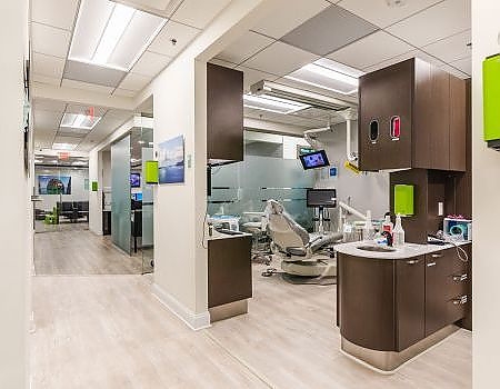 a kitchen with a refrigerator, sink, and cabinets  at CEREC crowns in Reston, VA